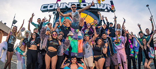 Headliners in front of the Countdown sign