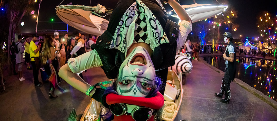 A performer hangs upside-down