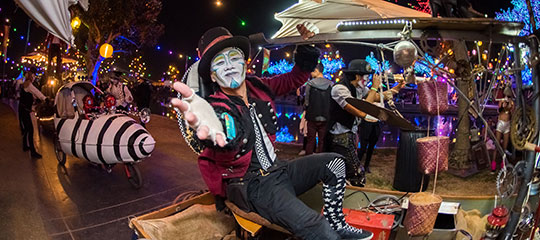 A performer reaches his hand out
