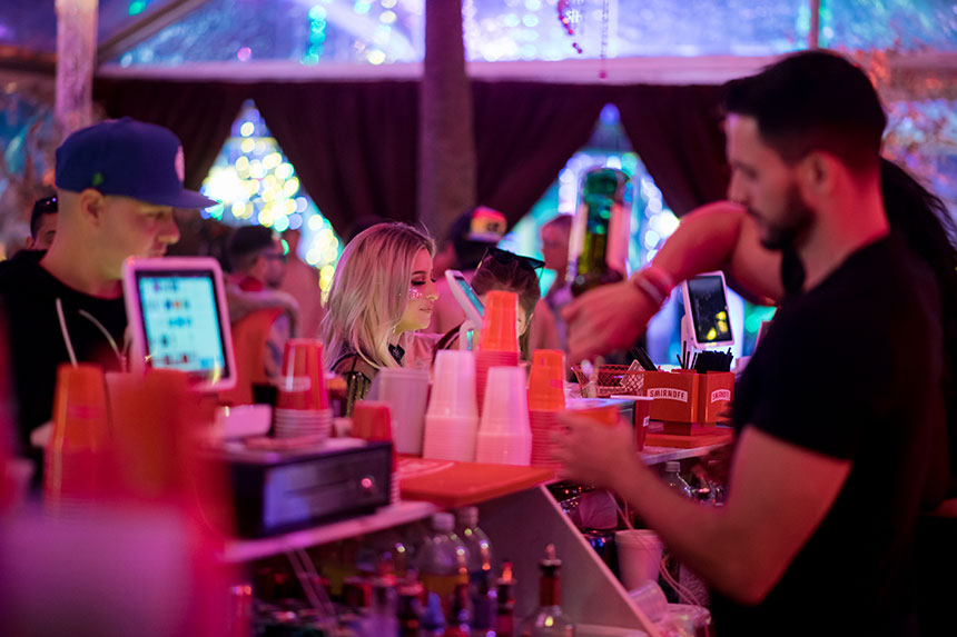 A bartender pouring drinks