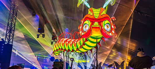 Caterpillar puppet above the crowd