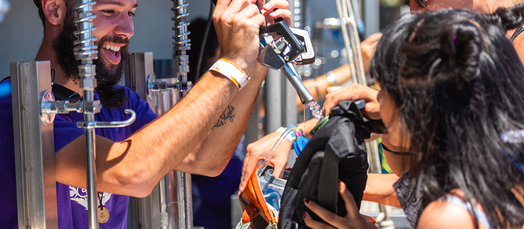 A Headliner refilling their hydration pack