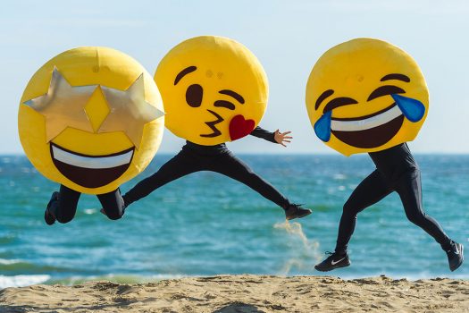 Emoji performers on the beach