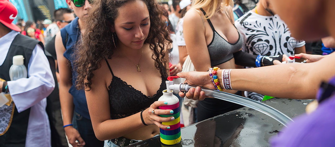A woman refilling her bottle