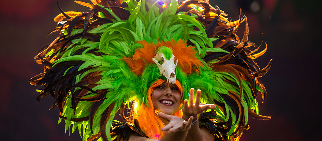 A performer in a feather headdress