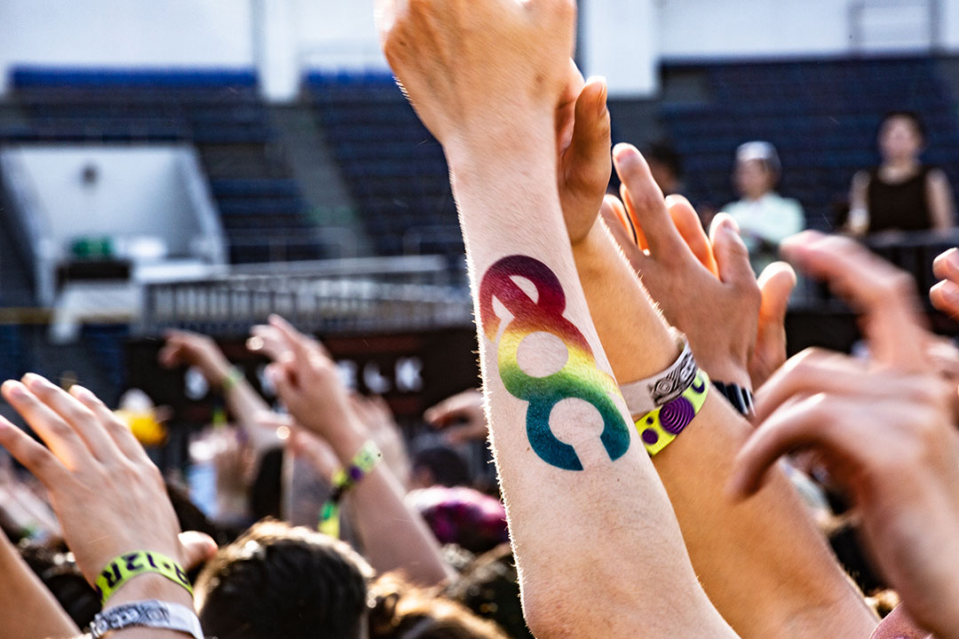 An arm with an EDC tattoo