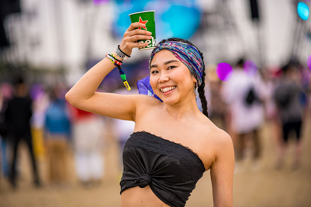 A woman with a Heineken cup