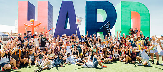 Fans in front of the HARD sign