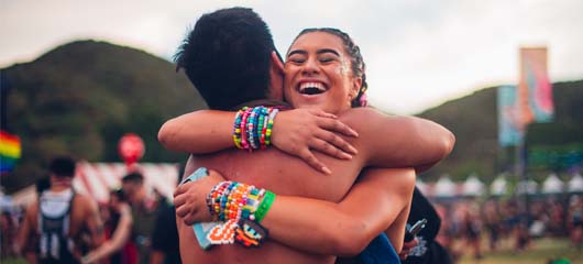 headliners hugging happily