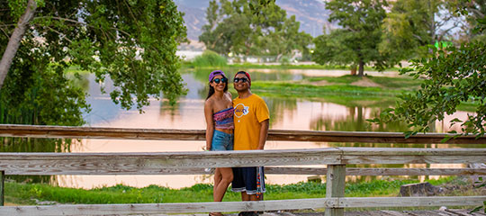 a couple by the water