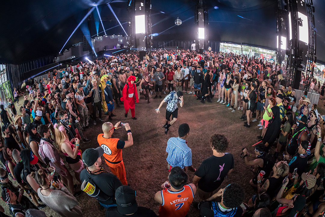 A dance circle forms in the crowd