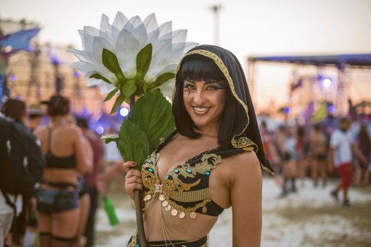 A costumed Headliner with a giant flower
