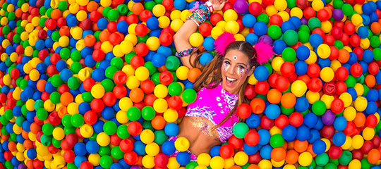 A Headliner enjoys the VIP ball pit