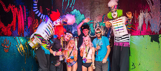 Headliners hang out with costumed performers in VIP