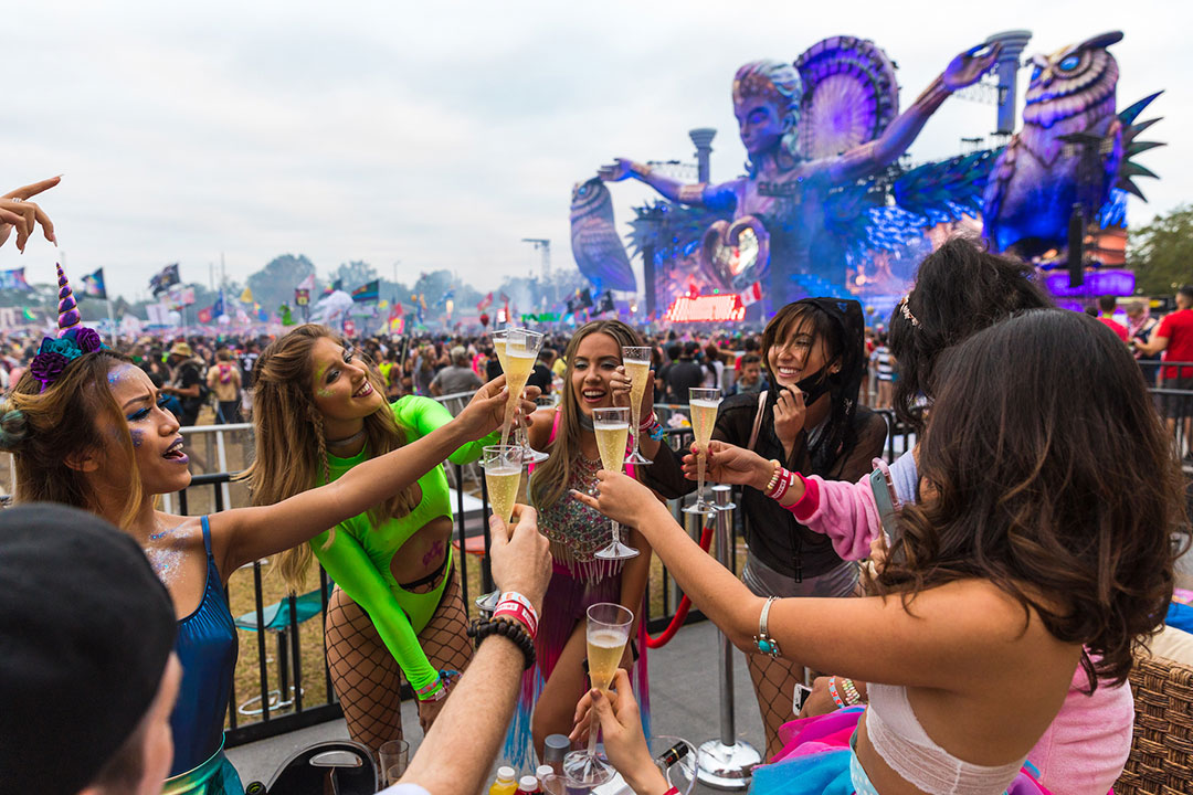 Headliners make a champagne toast at their SkyDeck table