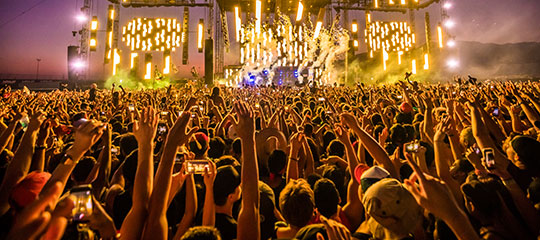 Fans with their hands in the air