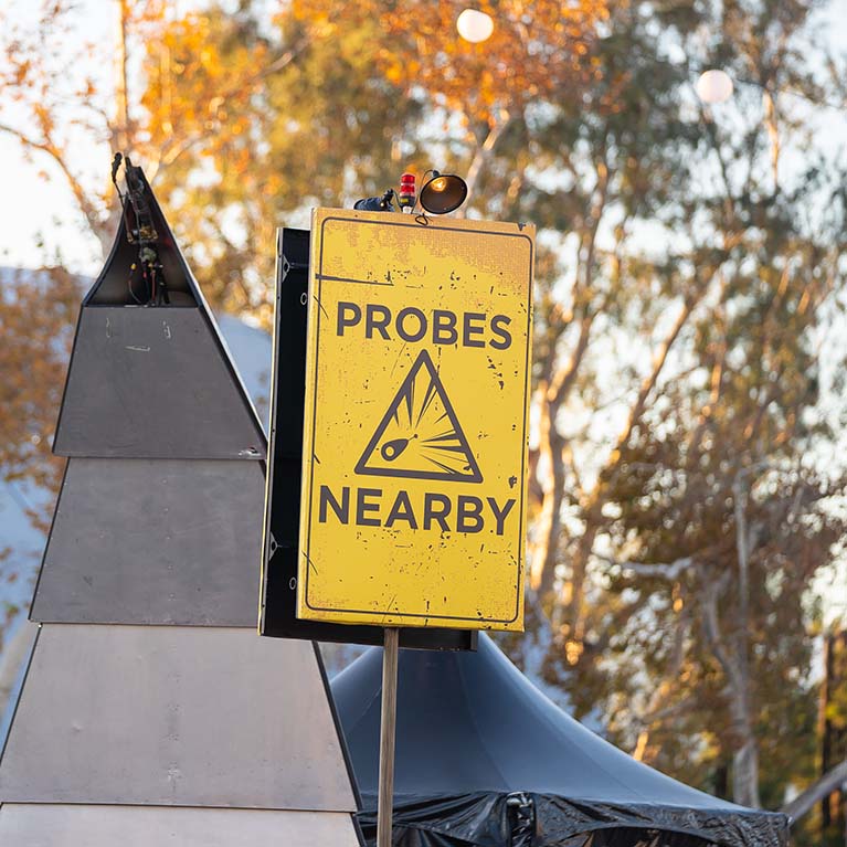 Alien warning sign saying "probes nearby"