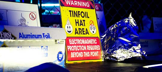 Tinfoil hat area warning sign